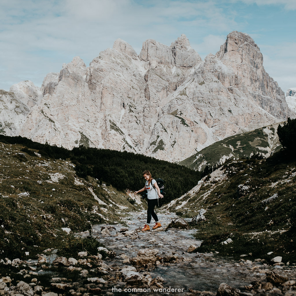 Walking across a creek on the Tre Cime di Lavaredo hike