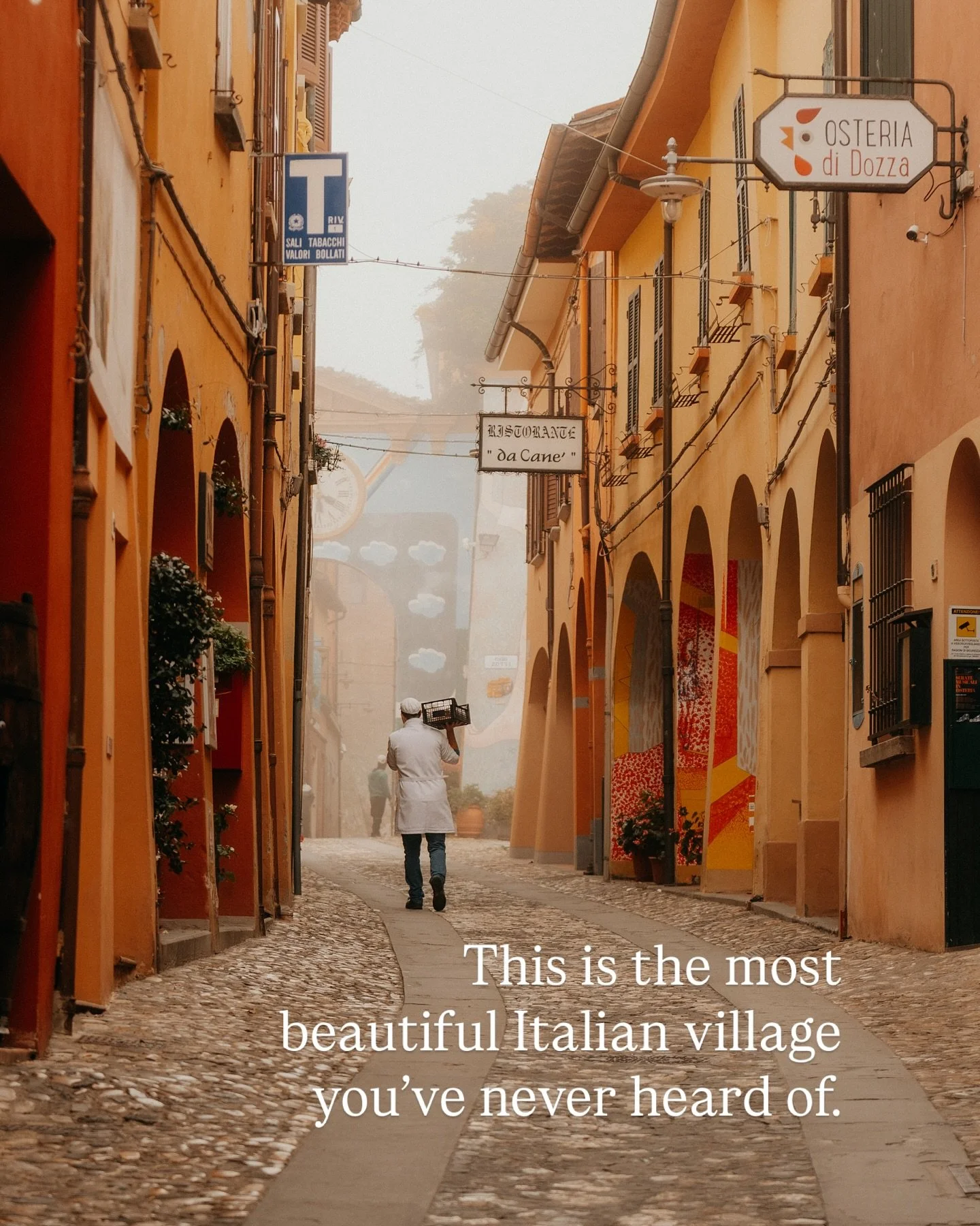 Dozza might be the most beautiful (and colourful) Italian village you&rsquo;ve  never heard of.

We visited in a misty, dreary October morning and were met with silence, apart from a baker carrying bread on his shoulder down empty cobbled laneway. 

