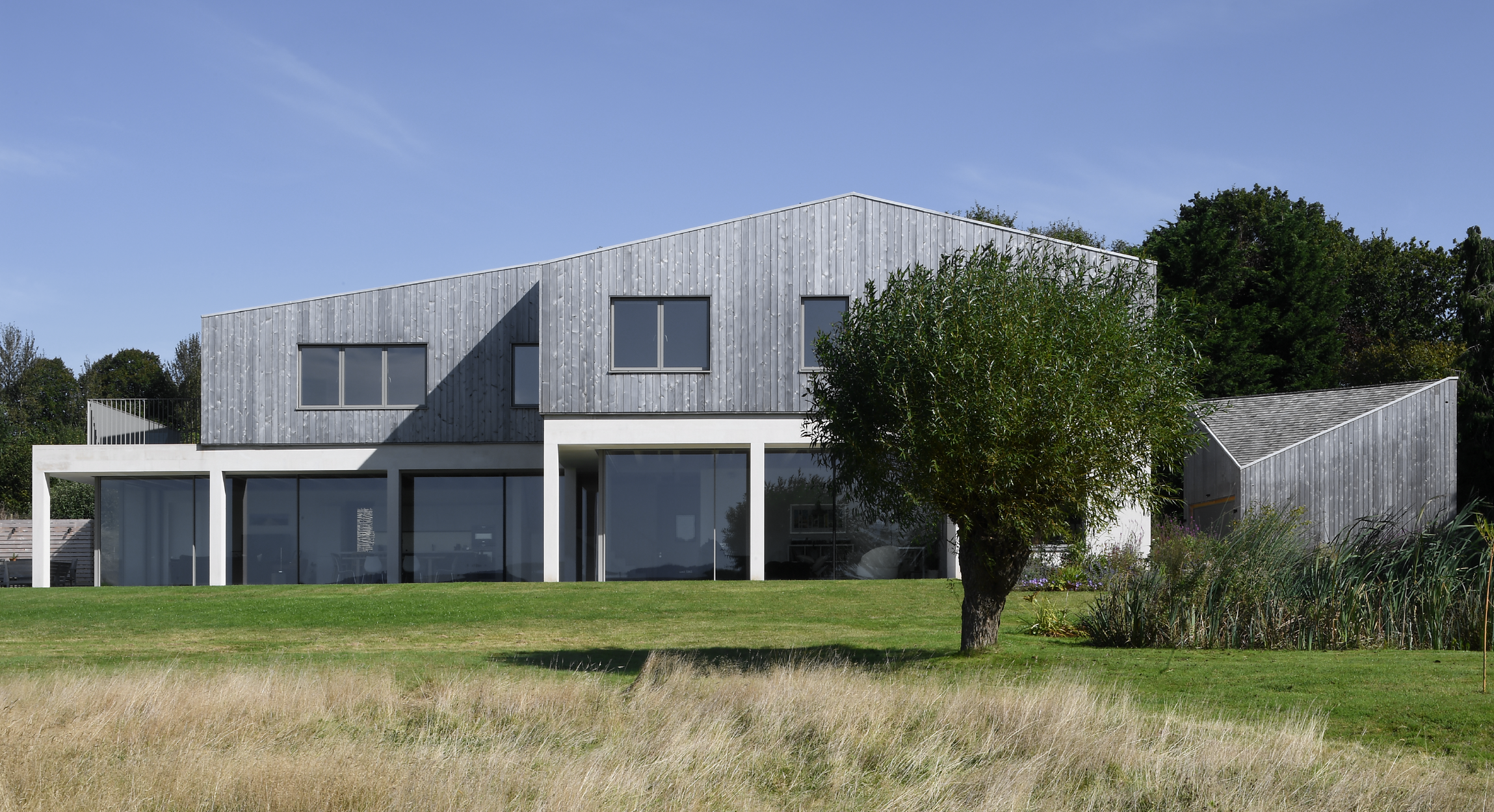 A home rooted in land and light