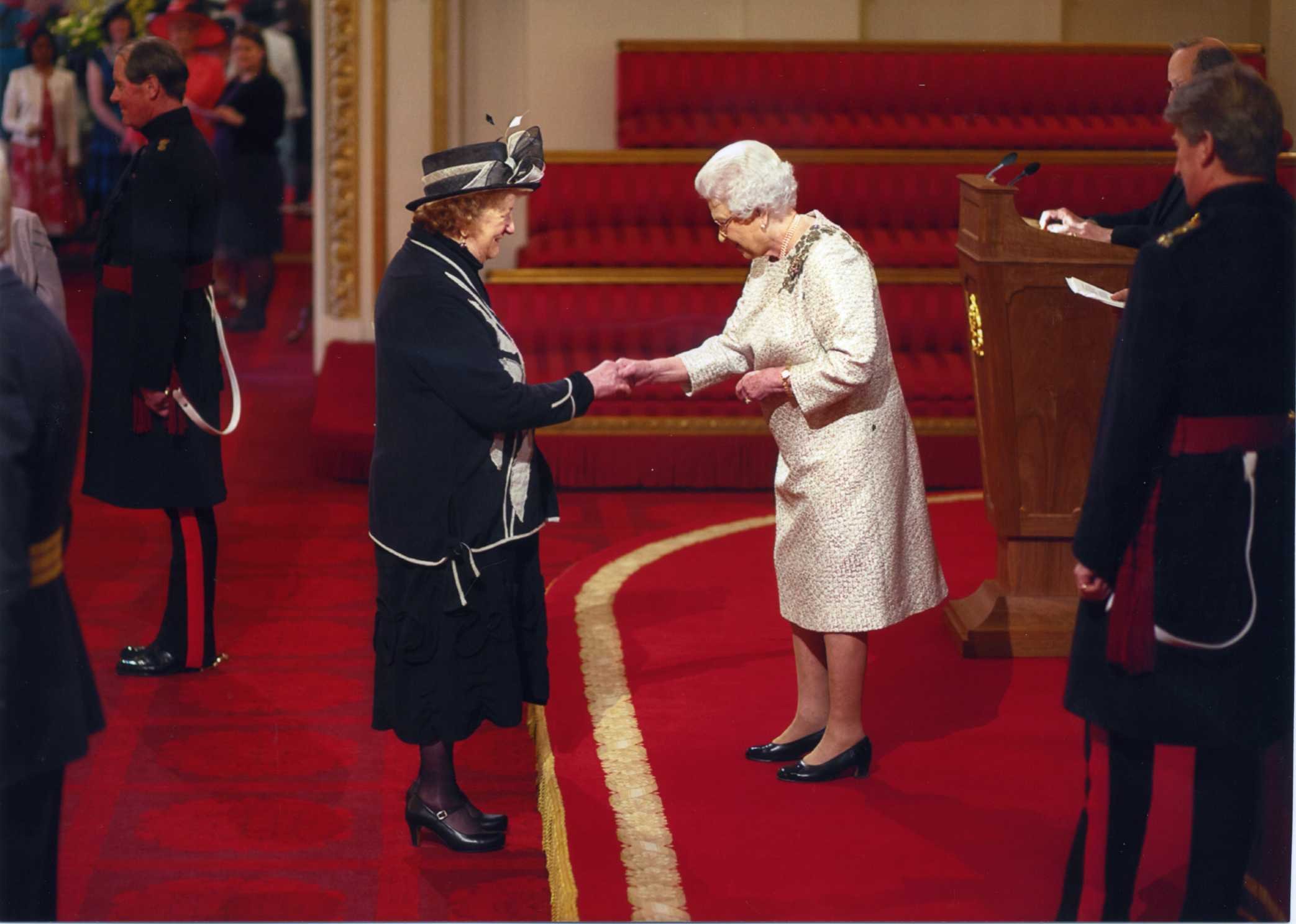 Melissa Receiving Her MBE from the Queen.jpeg