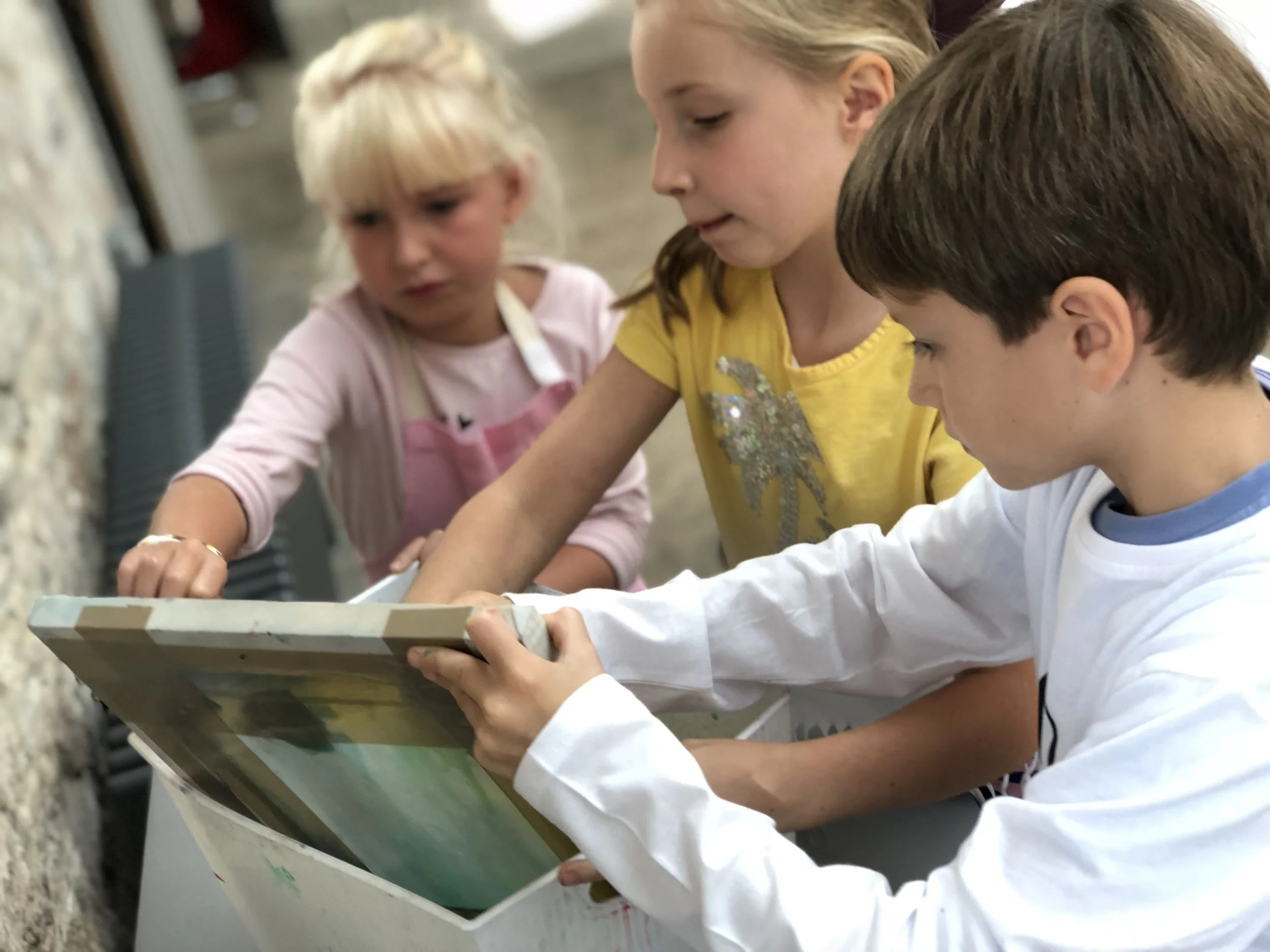 The children work together on all aspects of the printmaking process