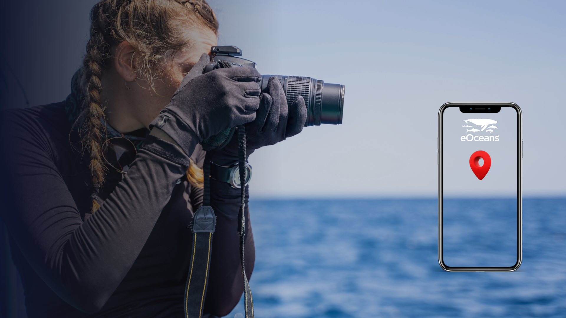 A woman taking a photograph with her camera near the ocean, with a large smartphone displaying the eOceans logo and a location pin icon over the water.