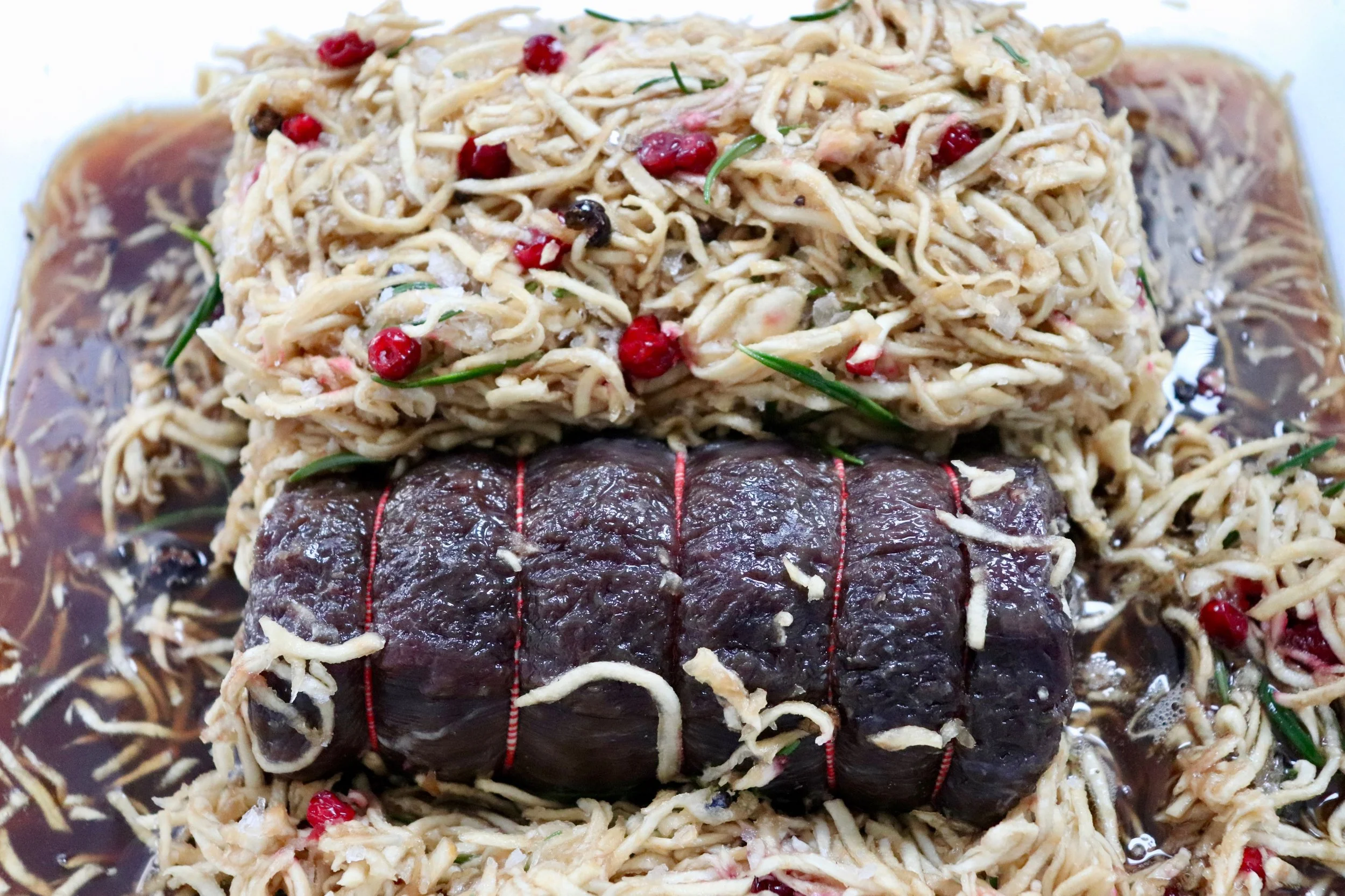 Venison loins in lingonberry, juniper and celeriac salt cure