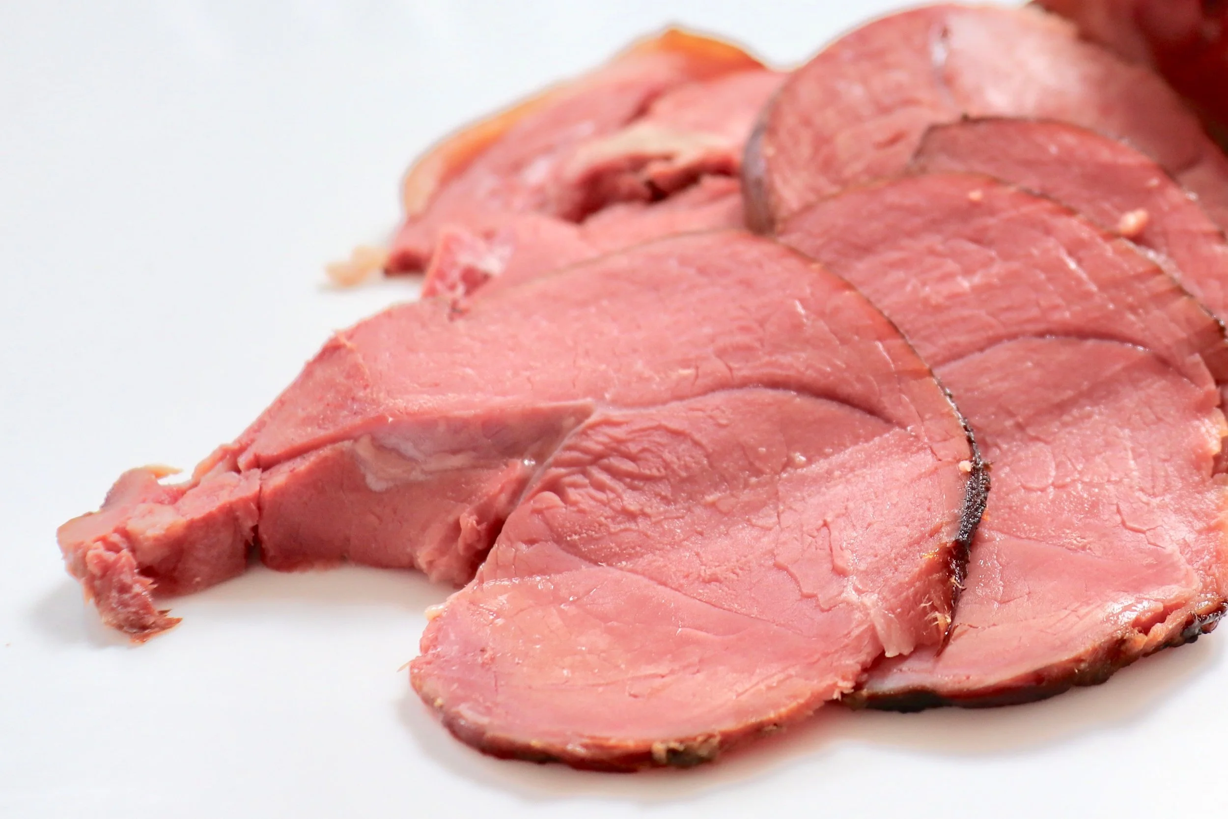 Succulent slices of smoked lamb ham with a fennel, coriander and chilli flake crust