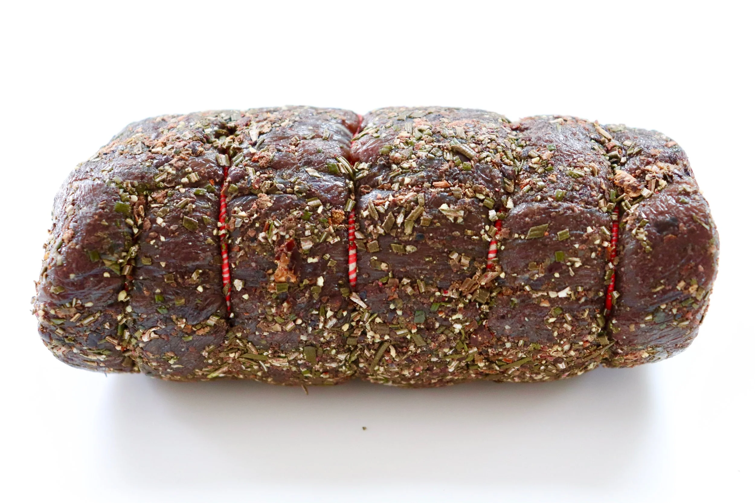 Venison loin rolled in in juniper, rosemary and black pepper
