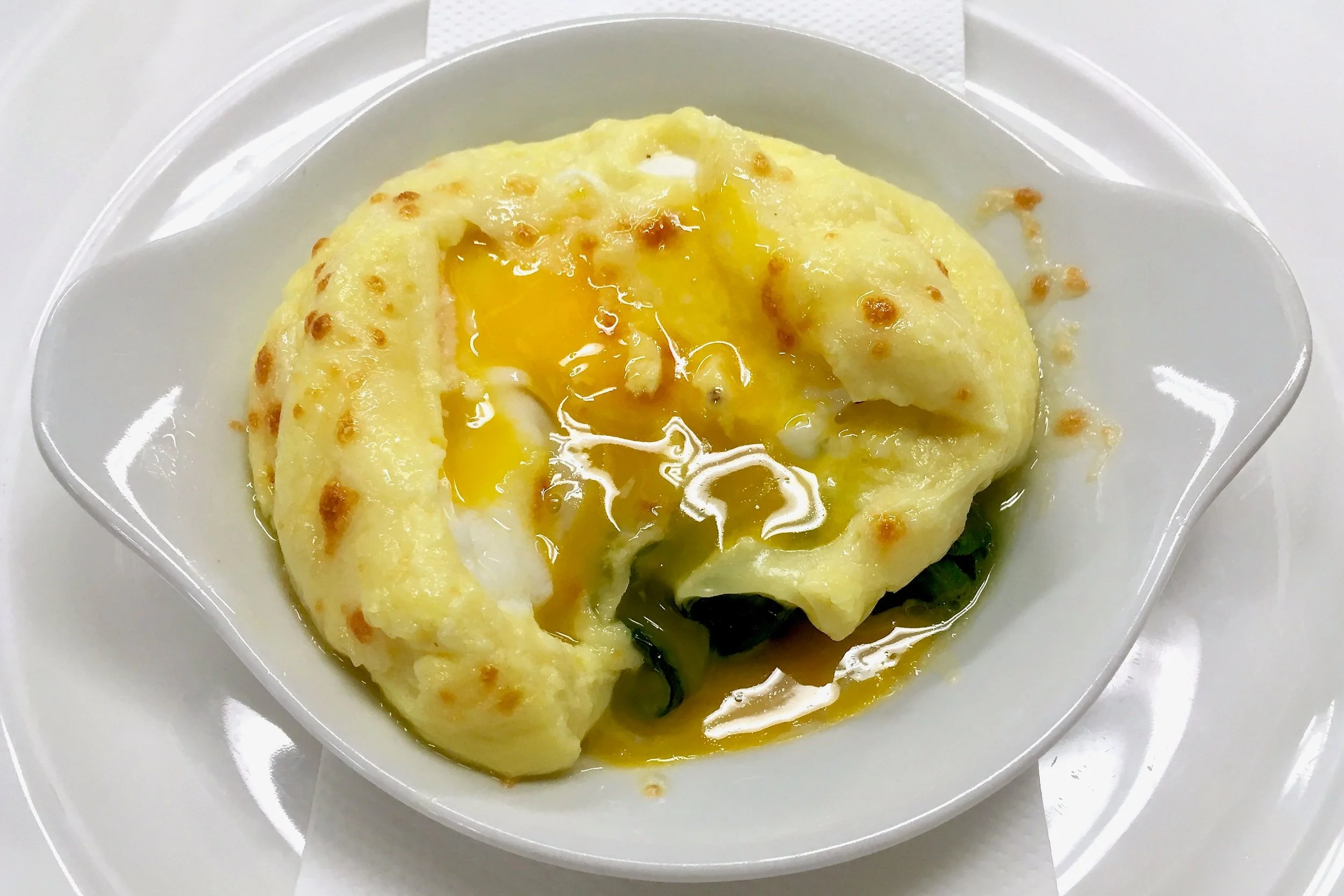 Poached egg on spinach in Mornay sauce