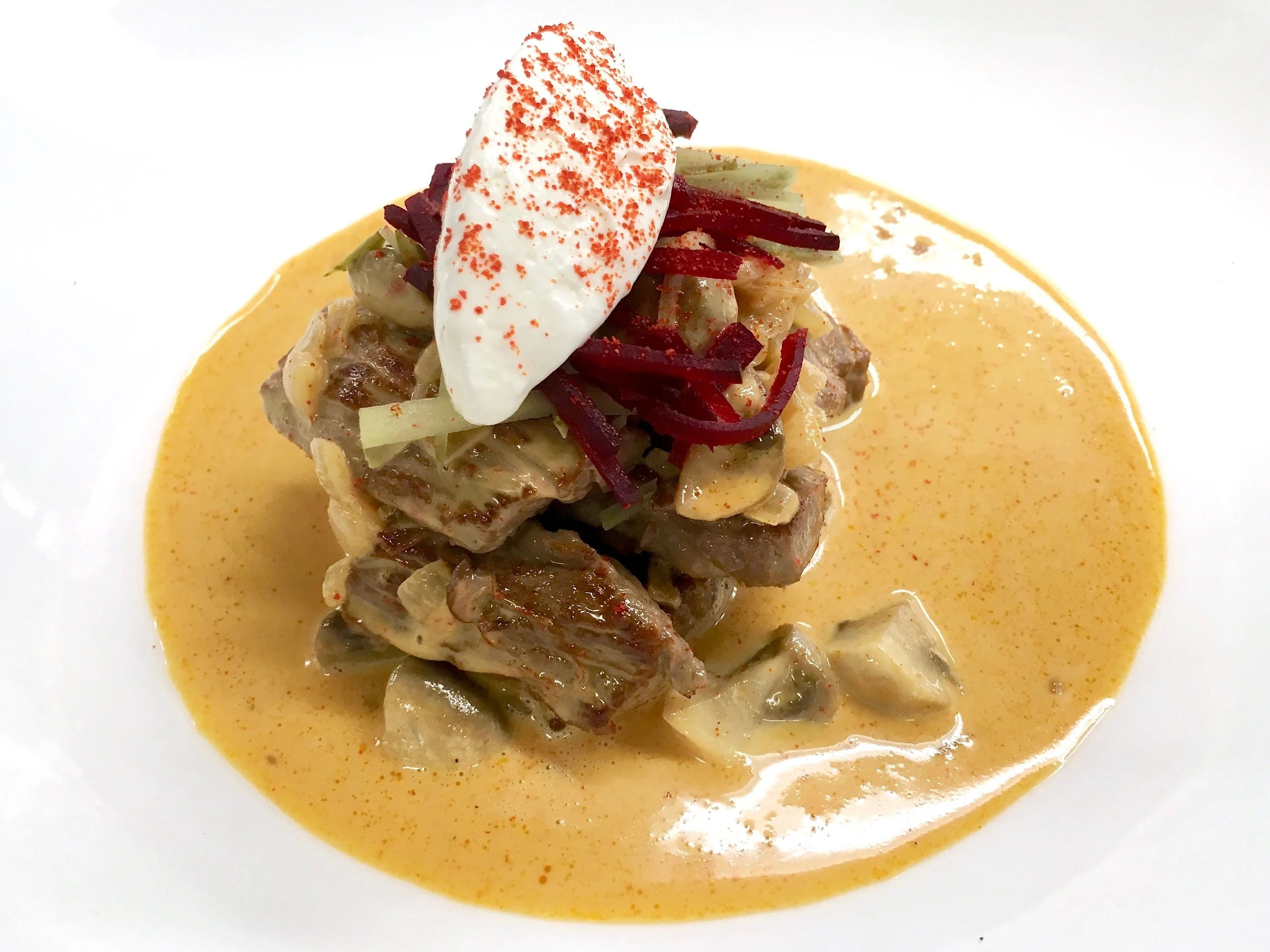 Beef stroganoff with beetroot and cornichon