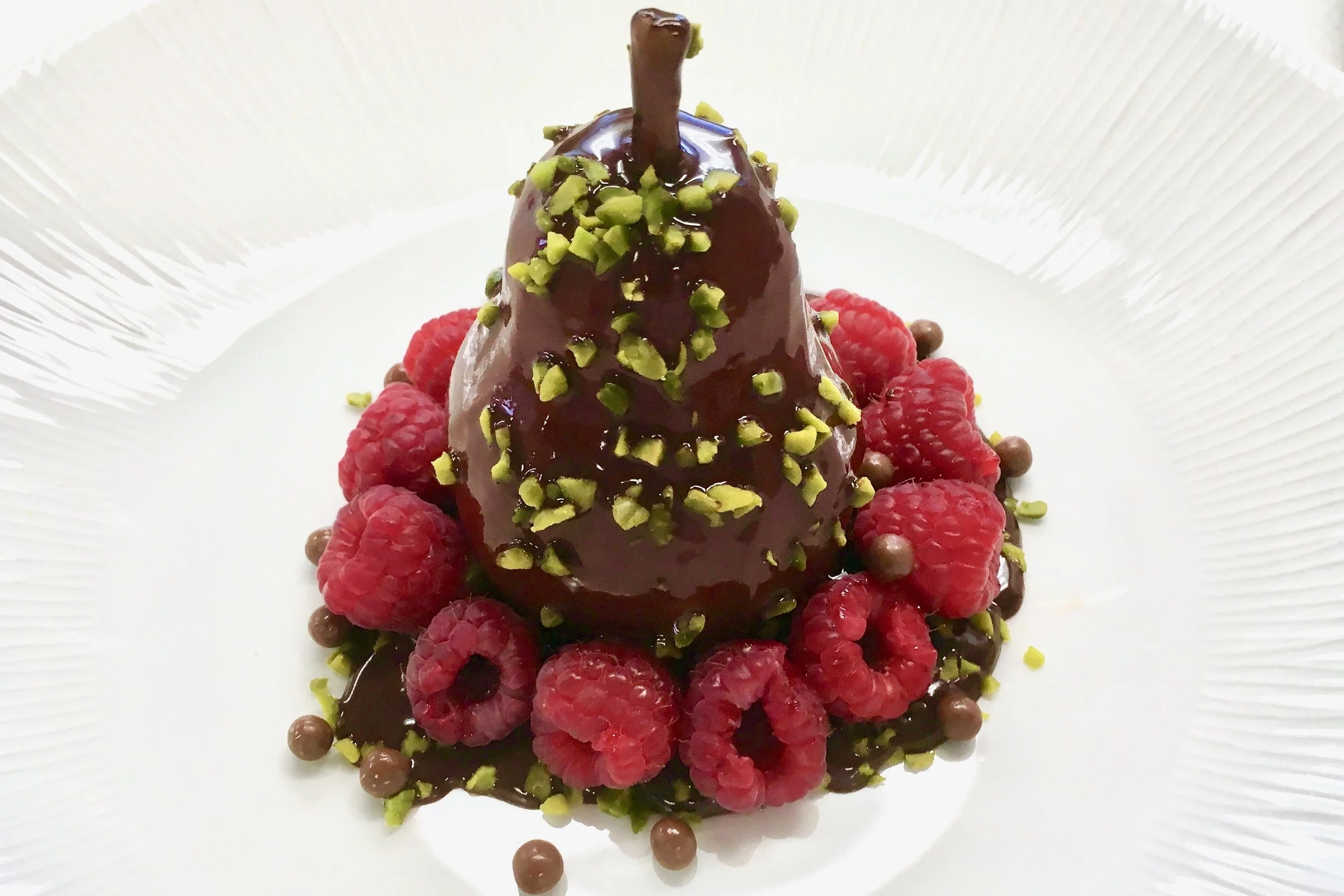 Poached pear in chocolate sauce