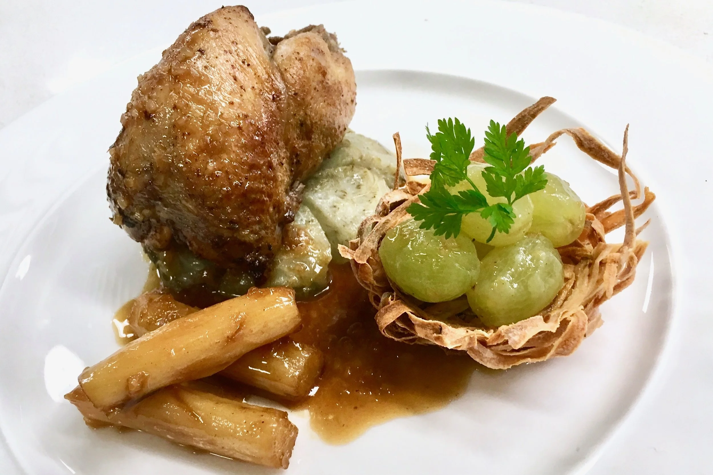 Roast quail with grapes in liquor and glazed salsify