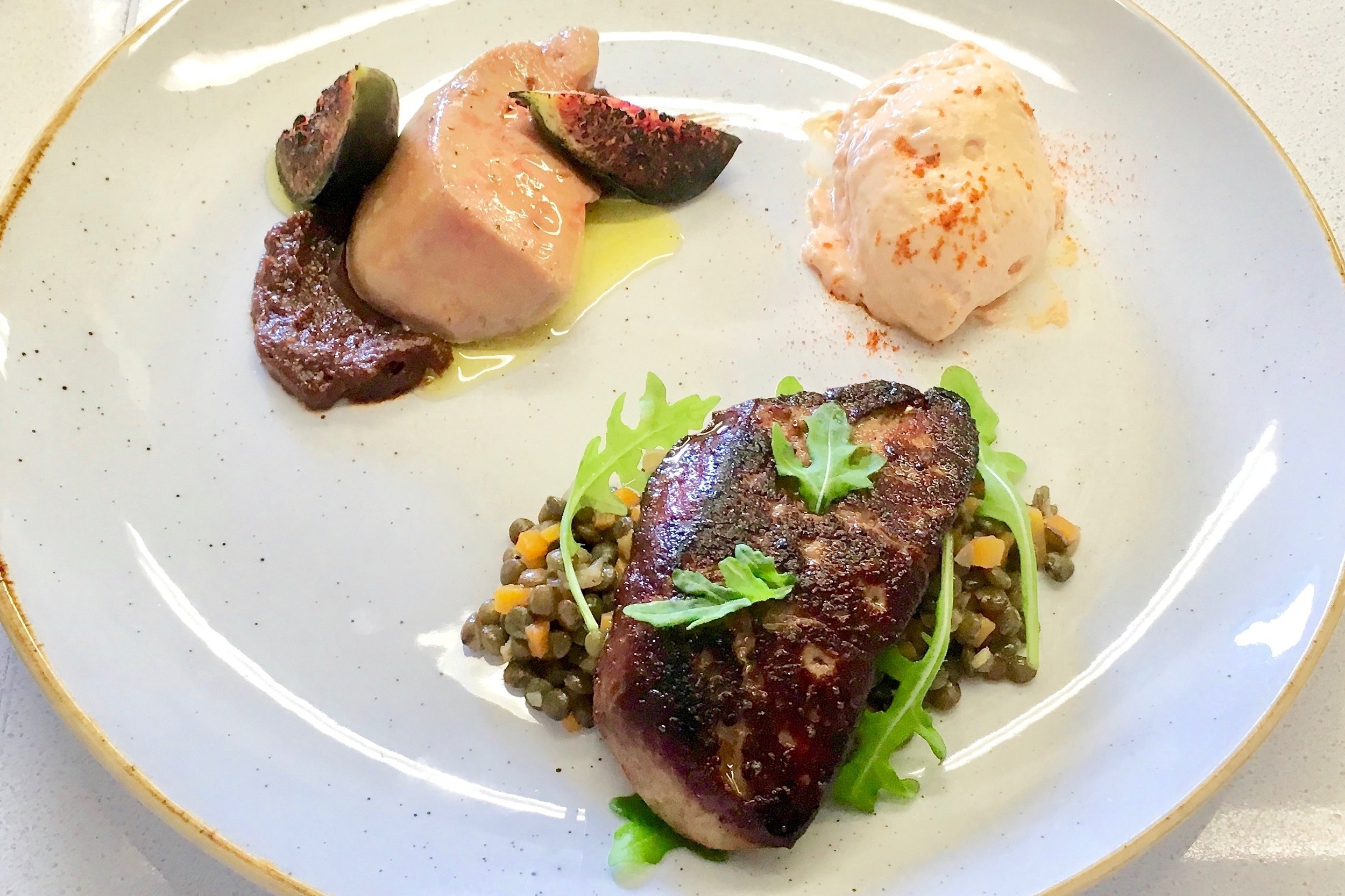 Poached and fried foie gras served with a foie gras espuma