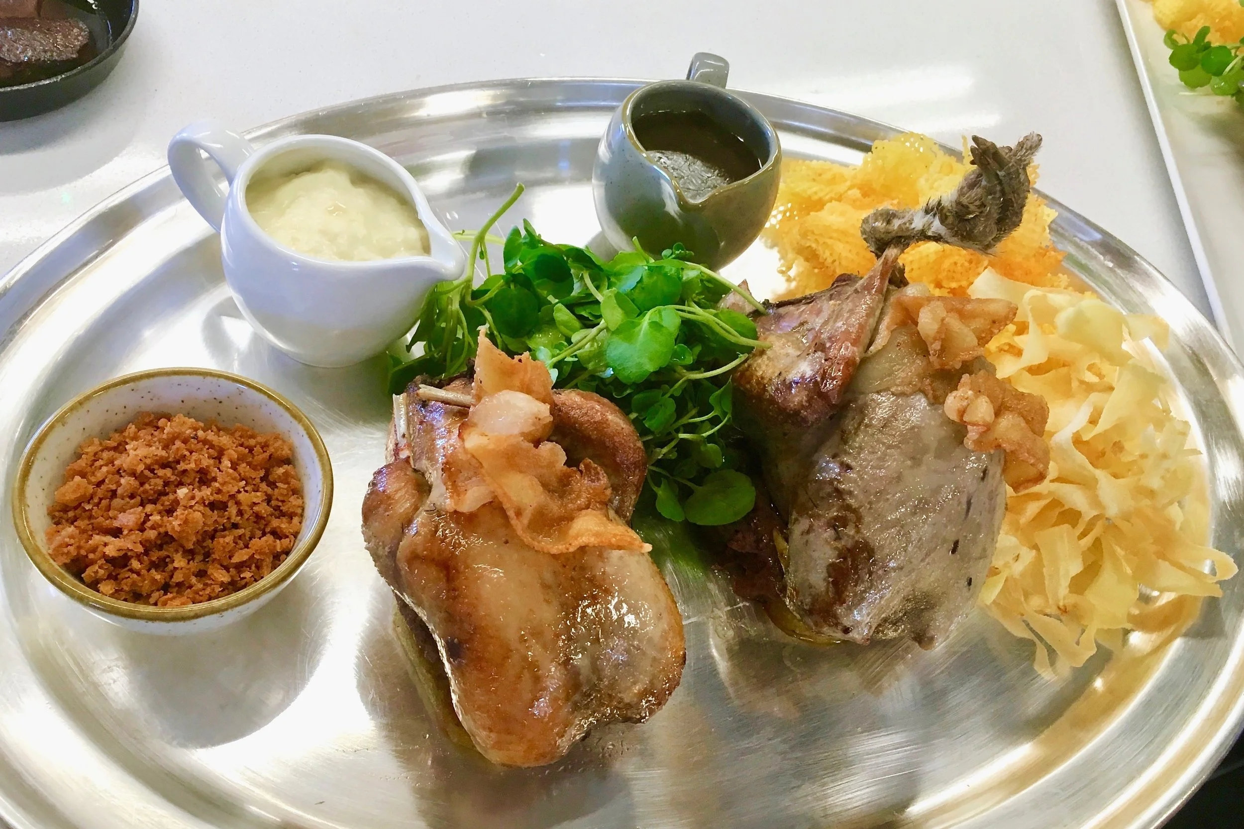 Grouse and red-legged partridge served traditionally with a game jus, bread sauce, fried breadcrumbs and Pommes Gaufrettes