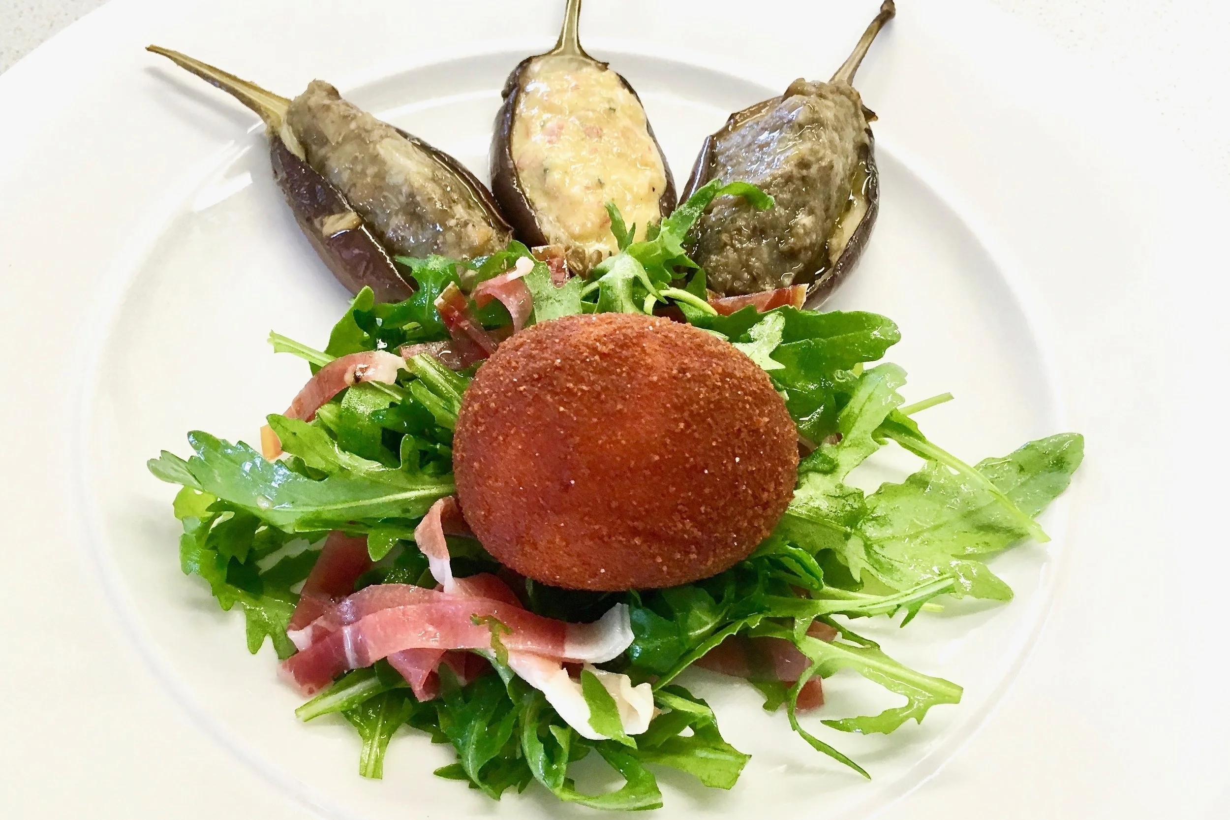 Egg in spiced breadcrumbs with a Bayonne ham salad in a red wine and shallot vinaigrette