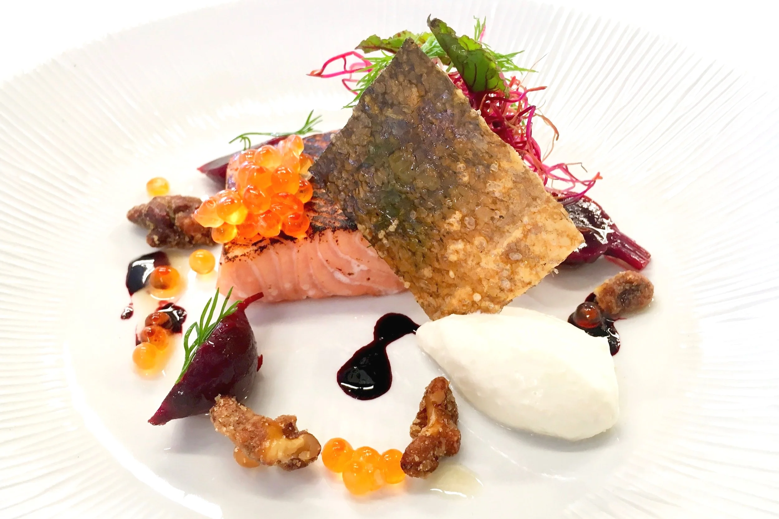 Steamed salmon steak plated differently