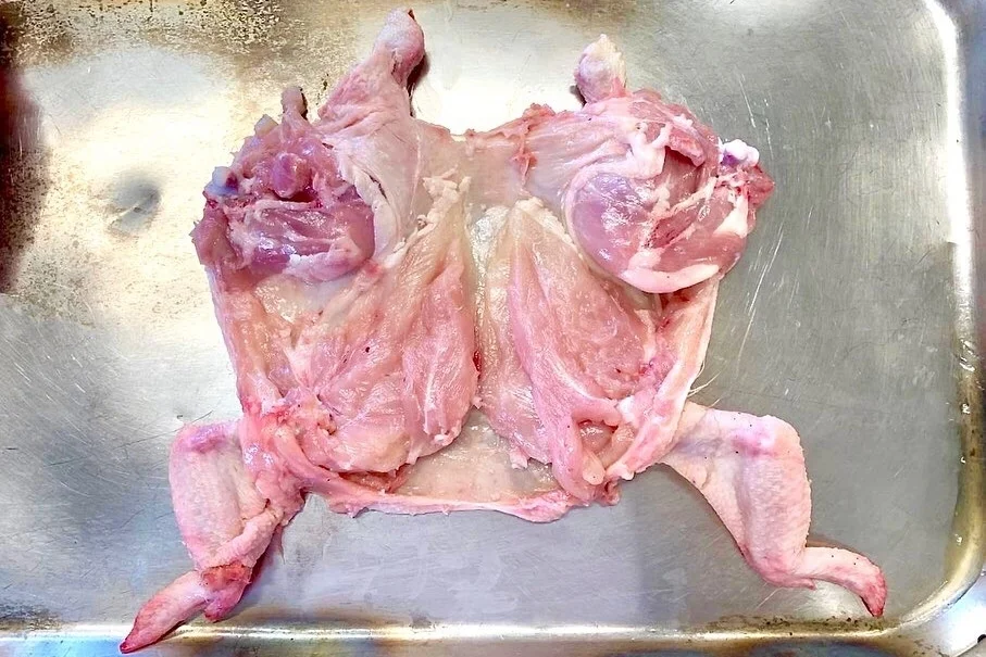 Poussin meat off the carcass. Legs and wings still have to be removed