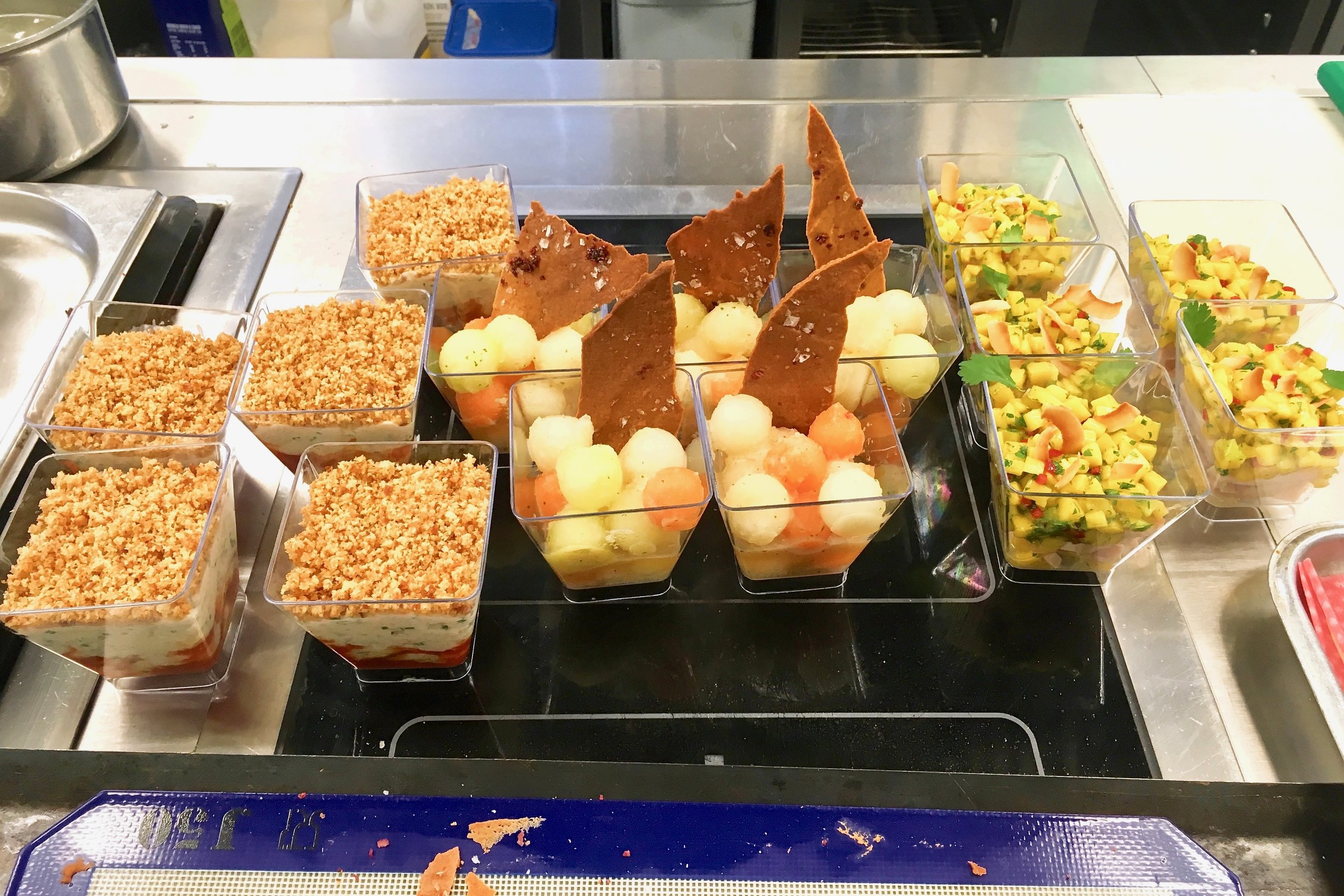 Left to right: Crab cheesecake, marinated melon and smoked chicken with mango salsa