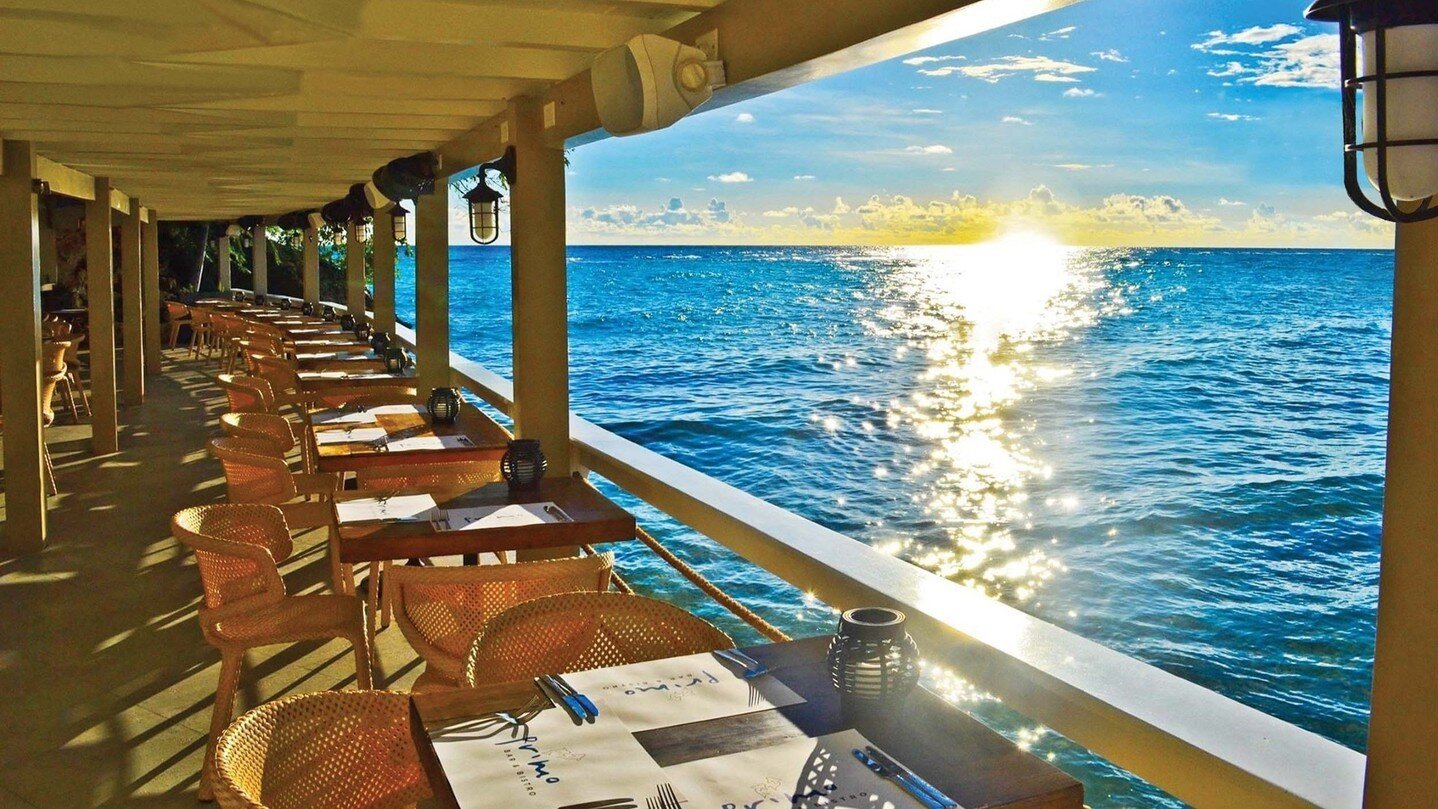 Primo  Bar &amp; Bistro
..
Idyllically located on the edge of St. Lawrence Bay, @primobarbados offers rustic sophistication with stunning views.
..
Its eclectic Mediterranean-style lunch and dinner menu offers an extensive selection of seafood, meat 