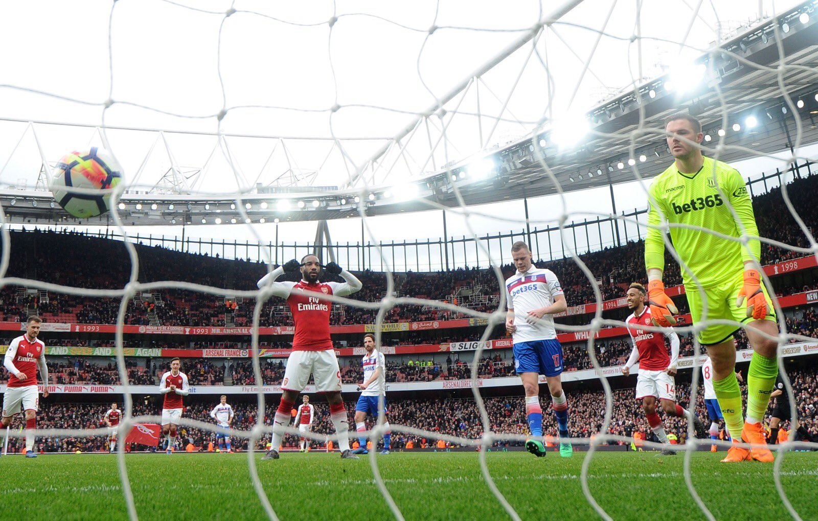Alexander Lacazette scores a goal for Arsenal in the English Premier League against Stoke City