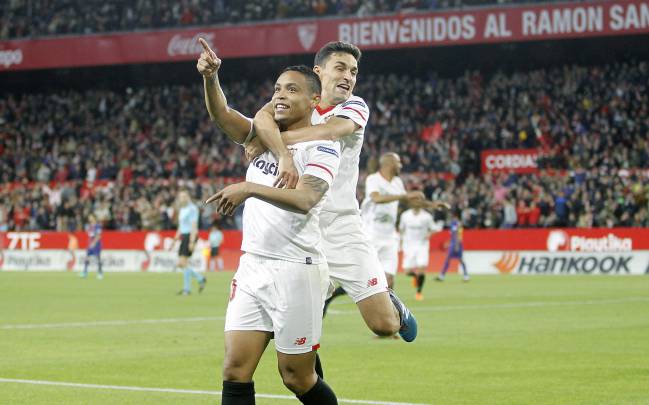 Luis Muriel and Jesus Navas celebrate a goal for Sevilla in La Liga