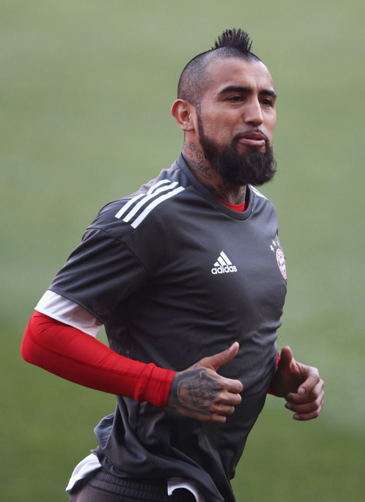 Bayern Munich player Arturo Vidal warms up for UEFA Champions League game against Sevilla