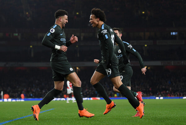 Leroy Sane of Manchester City celebrates the third goal with Kyle Walker during the Premier League match between Arsenal and Manchester City at Emirates Stadium on March 1, 2018 in London, England. (Feb. 28, 2018 - Source: Shaun Botterill/Getty Images Europe)