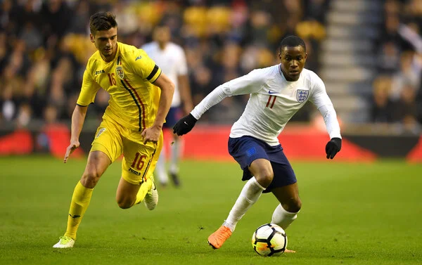 Ademola Lookman of England gets past Dragos Nedelcu of Romania during the International Friendly between England U21 and Romania U21 at Molineux on March 24, 2018 in Wolverhampton, England. (March 23, 2018 - Source: Gareth Copley/Getty Images Europe)