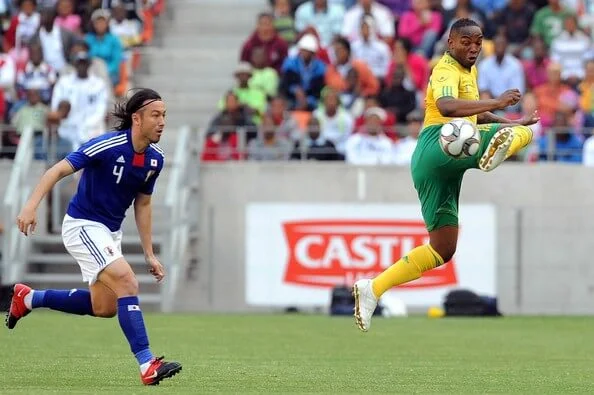 Benni McCarthy and Tanaka Marcus in action durng the International friendly match between South Africa and Japan at Nelson Mandela Bay Stadium on November 14, 2009 in Port Elizabeth, South Africa. (Nov. 13, 2009 - Source: Gallo Images/Getty Images Europe)