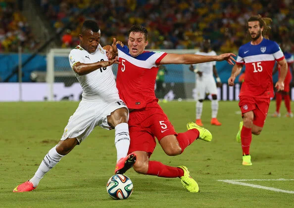 Matt Besler of the United States challenges Jordan Ayew of Ghana during the 2014 FIFA World Cup Brazil Group G match between Ghana and the United States at Estadio das Dunas on June 16, 2014 in Natal, Brazil. (June 15, 2014 - Source: Kevin C. Cox/Getty Images South America)