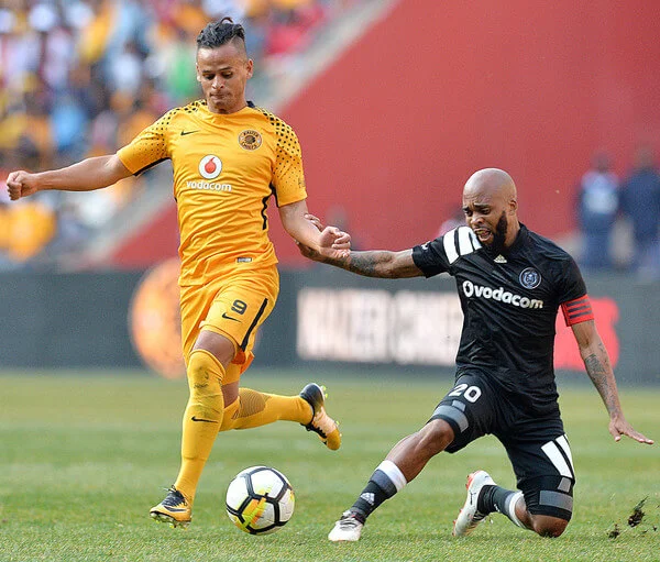 Gustavo Paez and Oupa Manyisa during the Carling Black Label Champion Cup match between Orlando Pirates and Kaizer Chiefs at FNB Stadium on July 29, 2017 in Johannesburg, South Africa. At least two people have been reported to have been killed and several injured in a crush during the game at South Africa's biggest stadium. (July 28, 2017 - Source: Gallo Images/Getty Images Europe)