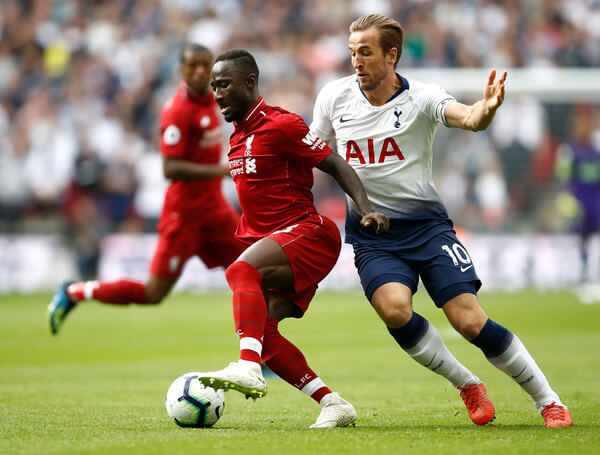 Naby Keita of Liverpool (L) is challenged by Harry Kane of Tottenham Hotspur during the Premier League match between Tottenham Hotspur and Liverpool FC at Wembley Stadium on September 15, 2018 in London, United Kingdom. (Sept. 14, 2018 - Source: Julian Finney/Getty Images Europe)