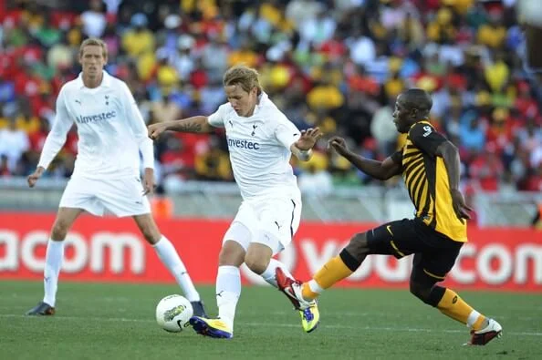 Roman Pavlyuchenko and Tinashe Nengomasha of Chiefs during the 2011 Vodacom Challenge match between Kaizer Chiefs and Tottenham Hotspur at Peter Mokaba Stadium on July 16, 2011 in Polokwane, South Africa. (July 15, 2011 - Source: Gallo Images/Getty Images Europe)