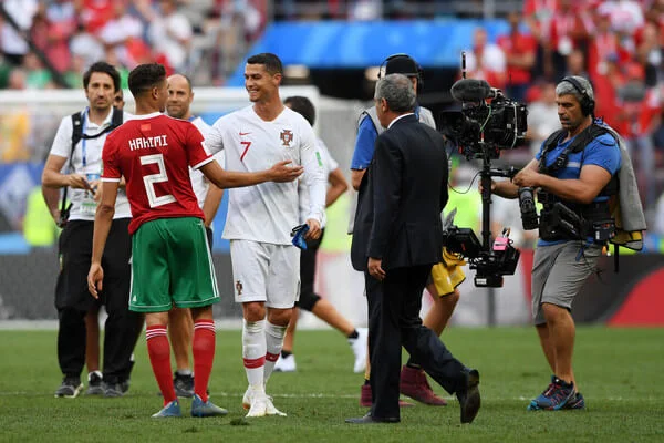 Cristiano Ronaldo of Portugal consoles Achraf Hakimi of Morocco following Morocco's elimination from the World Cup after their defeat in the 2018 FIFA World Cup Russia group B match between Portugal and Morocco at Luzhniki Stadium on June 20, 2018 in Moscow, Russia. (June 19, 2018 - Source: Stu Forster/Getty Images Europe)