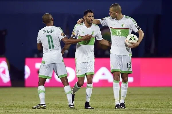 Algeria's forward Riyad Mahrez (C) celebrates with Algeria's midfielder Yacine Brahimi (R) and Algeria's forward Islam Slimani after scoring a second goal during the 2017 Africa Cup of Nations group B football match between Algeria and Zimbabwe in Franceville on January 15, 2017. / AFP / KHALED DESOUKI (Jan. 14, 2017 - Source: AFP)