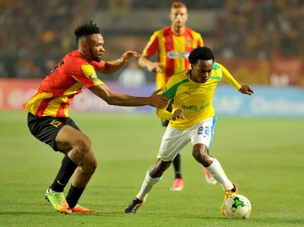 South Africa's Sundowns striker Percy Tau vies with Tunisia's Esperance of Tunis forward Foussiny Coulibaly (L) during the African Champions League (CAF) group stage football match on June 22, 2017 in olympic Rades Stadium near Tunis. / AFP PHOTO / SALAH HABIBI (June 20, 2017 - Source: AFP)