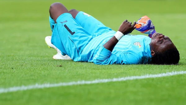 Patricia Mantey of Ghana lies injured on the pitch during the women's international friendly match between Germnay and Ghana at Benteler Arena on July 22, 2016 in Paderborn, Germany. (July 21, 2016 - Source: Lars Baron/Bongarts)