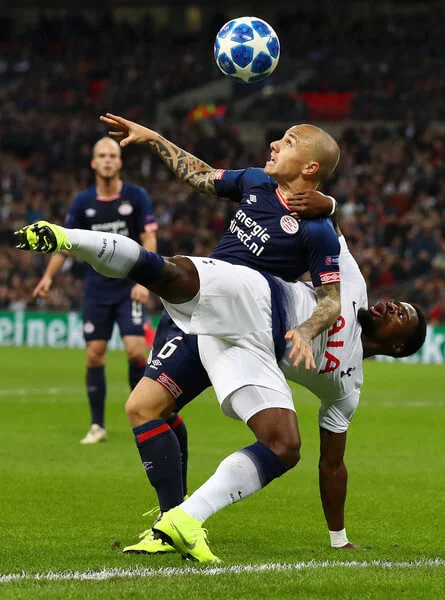 Serge Aurier of Tottenham Hotspur is challenged by Jose Tasende of PSV Eindhoven during the Group B match of the UEFA Champions League between Tottenham Hotspur and PSV at Wembley Stadium on November 6, 2018 in London, United Kingdom. (Nov. 5, 2018 - Source: Clive Rose/Getty Images Europe)