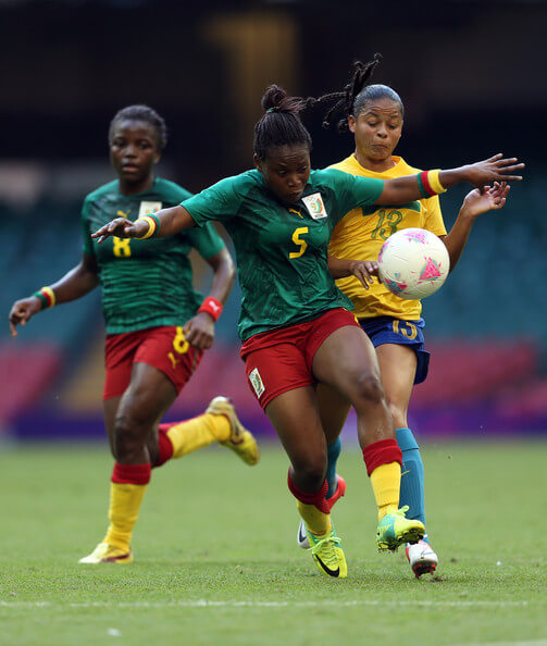 Augustine Ejangue of Cameroon battles with Barbara of Brazil during the Women's Football first round Group E Match of the London 2012 Olympic Games between Cameroon and Brazil at Millennium Stadium on July 25, 2012 in Cardiff, Wales. (July 24, 2012 - Source: Julian Finney/Getty Images Europe)