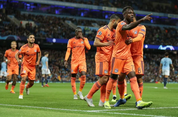 Maxwell Cornet of Lyon celebrates after scoring his team's first goal with his team mates during the Group F match of the UEFA Champions League between Manchester City and Olympique Lyonnais at Etihad Stadium on September 19, 2018 in Manchester, United Kingdom. (Sept. 18, 2018 - Source: Richard Heathcote/Getty Images Europe)
