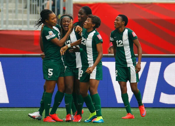Francisca Ordega #17 of Nigeria celebrates her game-tying goal against Sweden with Onome Ebi #5, Asisat Oshoala #8 and Ngozi Ebere #23 during the FIFA Women's World Cup Canada 2015 Group D match between Sweden and Nigeria at Winnipeg Stadium on June 8, 2015 in Winnipeg, Canada. (June 7, 2015 - Source: Kevin C. Cox/Getty Images North America)