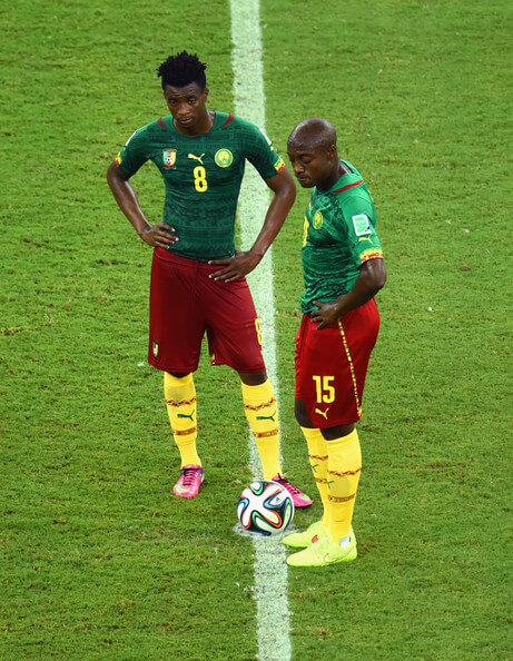 Benjamin Moukandjo and Pierre Webo of Cameroon wait to kick off after a goal during the 2014 FIFA World Cup Brazil Group A match between Cameroon and Croatia at Arena Amazonia on June 18, 2014 in Manaus, Brazil. (June 17, 2014 - Source: Stu Forster/Getty Images South America)
