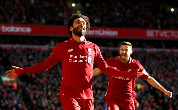 Mohamed Salah of Liverpool celebrates after scoring his team's first goal during the Premier League match between Liverpool FC and Cardiff City at Anfield on October 27, 2018 in Liverpool, United Kingdom. (Oct. 26, 2018 - Source: Jan Kruger/Getty Images Europe)