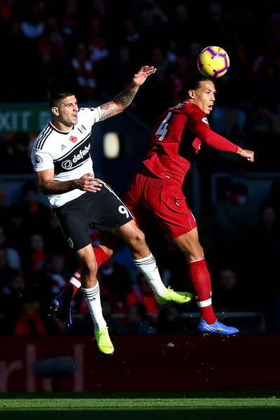 Aleksandar Mitrovic of Fulham battles for possession with Virgil van Dijk of Liverpool during the Premier League match between Liverpool FC and Fulham FC at Anfield on November 11, 2018 in Liverpool, United Kingdom. (Nov. 10, 2018 - Source: Alex Livesey/Getty Images Europe)