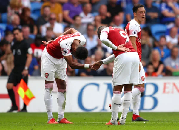 Alexandre Lacazette of Arsenal (9) celebrates with Pierre-Emerick Aubameyang as he scores his team's third goal during the Premier League match between Cardiff City and Arsenal FC at Cardiff City Stadium on September 2, 2018 in Cardiff, United Kingdom. (Sept. 1, 2018 - Source: Catherine Ivill/Getty Images Europe)