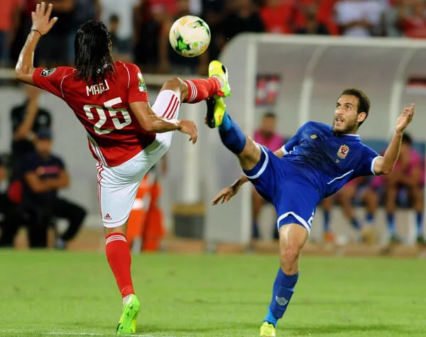 Sahel's striker Amro Marai (L) vies for the ball with Ahly's Hisham Mohamed (R) during the CAF Champions League semi-final football match between Etoile Sahel vs Al-Ahly at the Olympic Stadium in Sousse on October 1, 2017. / AFP PHOTO / SALAH HABIBI (Sept. 30, 2017 - Source: AFP)