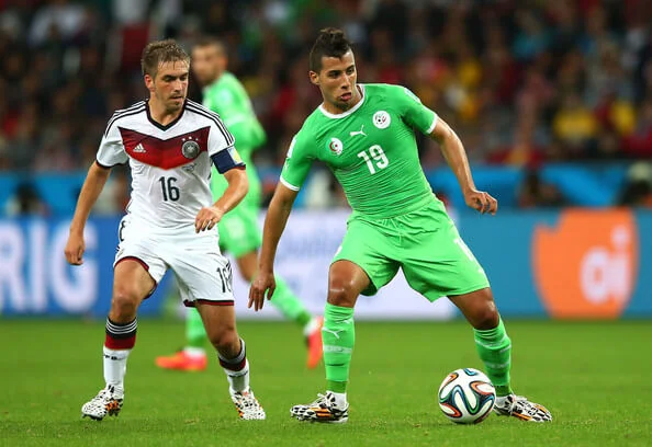 Saphir Taider of Algeria controls the ball against Philipp Lahm of Germany during the 2014 FIFA World Cup Brazil Round of 16 match between Germany and Algeria at Estadio Beira-Rio on June 30, 2014 in Porto Alegre, Brazil. (June 29, 2014 - Source: Julian Finney/Getty Images South America)