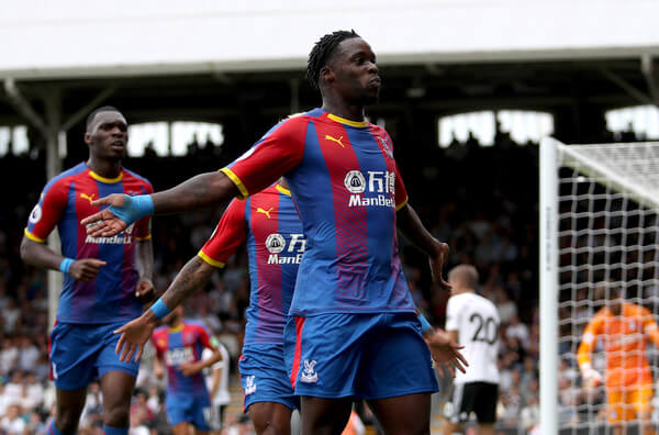 Jeffrey Schlupp of Crystal Palace celebrates after scoring his team's first goal during the Premier League match between Fulham FC and Crystal Palace at Craven Cottage on August 11, 2018 in London, United Kingdom. (Aug. 10, 2018 - Source: Christopher Lee/Getty Images Europe)