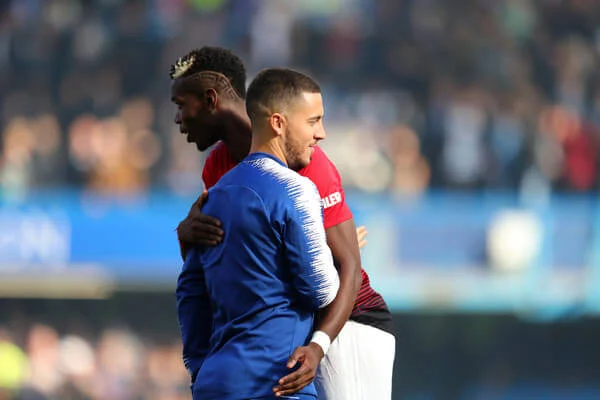 Paul Pogba of Manchester United and Eden Hazard of Chelsea embrace prior to the Premier League match between Chelsea FC and Manchester United at Stamford Bridge on October 20, 2018 in London, United Kingdom. (Oct. 19, 2018 - Source: Catherine Ivill/Getty Images Europe)