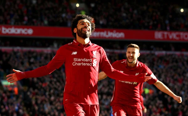 Mohamed Salah of Liverpool celebrates after scoring his team's first goal during the Premier League match between Liverpool FC and Cardiff City at Anfield on October 27, 2018 in Liverpool, United Kingdom. (Oct. 26, 2018 - Source: Jan Kruger/Getty Images Europe)