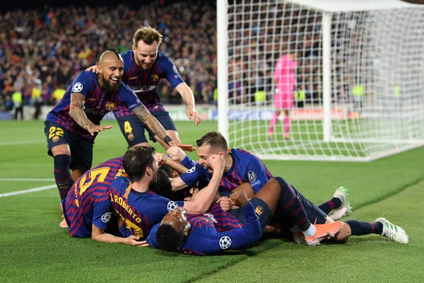 Lionel Messi of Barcelona celebrates with his team mates after he scores his sides third goal during the UEFA Champions League Semi Final first leg match between Barcelona and Liverpool at the Nou Camp on May 01, 2019 in Barcelona, Spain. (April 30, 2019 - Source: Getty Images Europe)