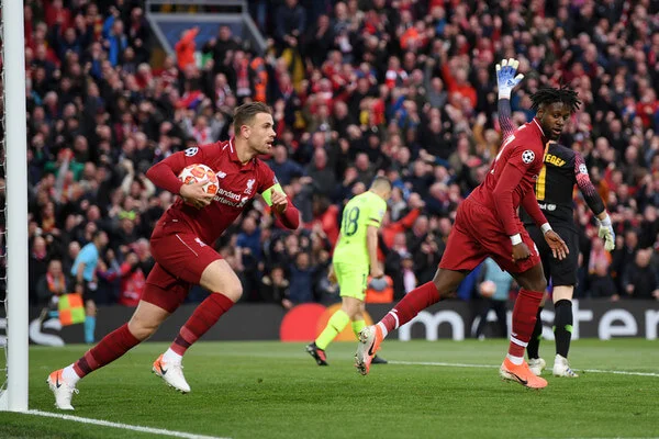 Jordan Henderson of Liverpool celebrates as Divock Origi (R) scores his team's first goal during the UEFA Champions League Semi Final second leg match between Liverpool and Barcelona at Anfield on May 07, 2019 in Liverpool, England. (May 6, 2019 - Source: Getty Images Europe)