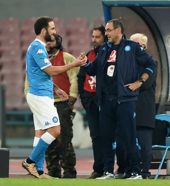 Napoli's coach Maurizio Sarri greets coach player Gonzalo Higuain during the TIM Cup match between SSC Napoli and Hellas Verona FC at Stadio San Paolo on December 16, 2015 in Naples, Italy. (Dec. 15, 2015 - Source: Francesco Pecoraro/Getty Images Europe)